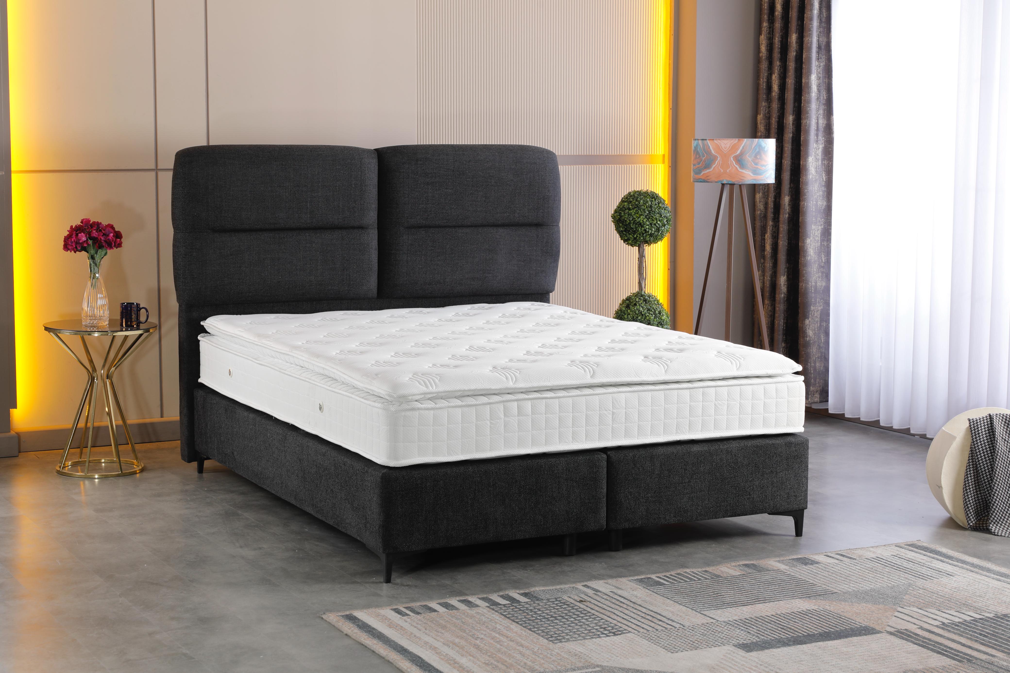 Απεικονίζεται το κρεβάτι Auro με στρώμα σε ένα δωμάτιο.